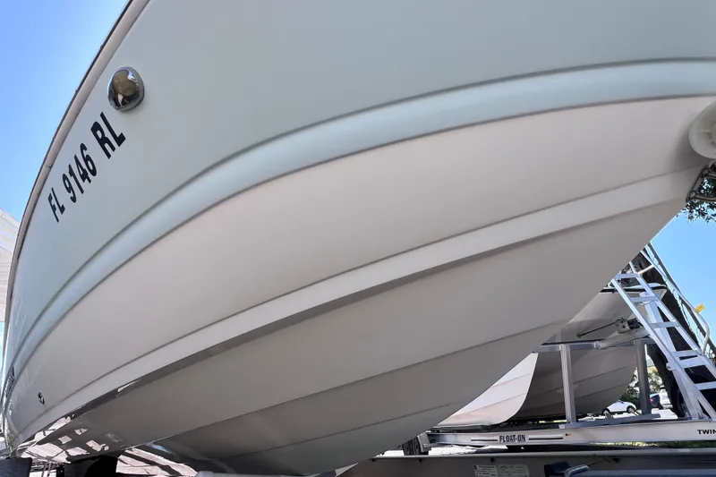 Slide: The Image of 2017 Stingray 182 SC boat on trailer, close-up view of hull and registration number. - 3