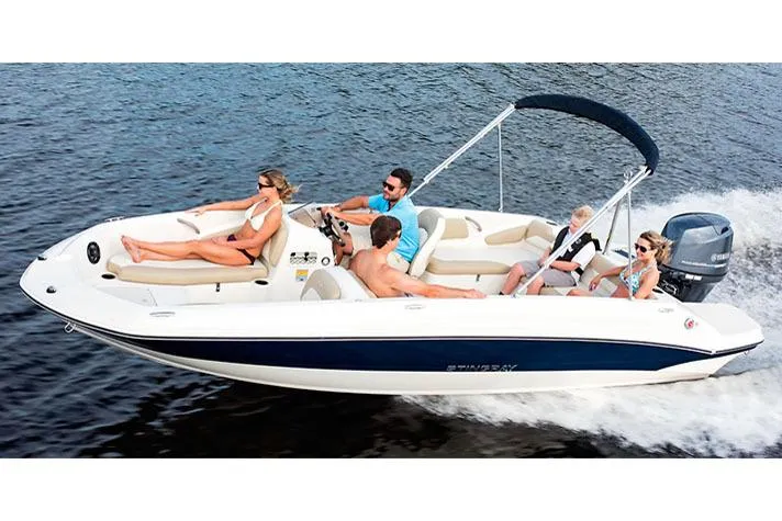 Slide: The Image of Manufacturer Provided Image: 2017 Stingray 182 SC boat cruising with passengers on a sunny day. - 33
