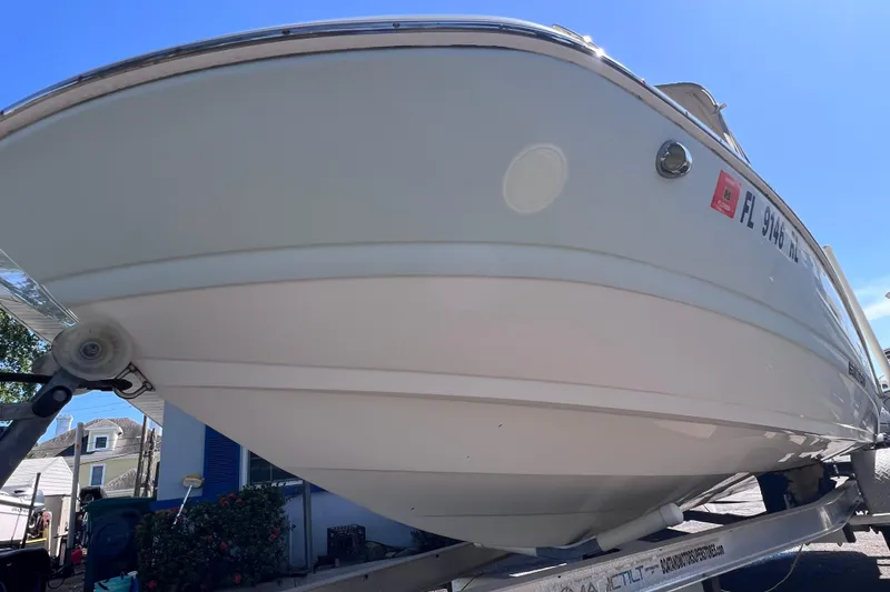 Slide: The Image of 2017 Stingray 182 SC boat on trailer, viewed from below, with registration number visible. - 4