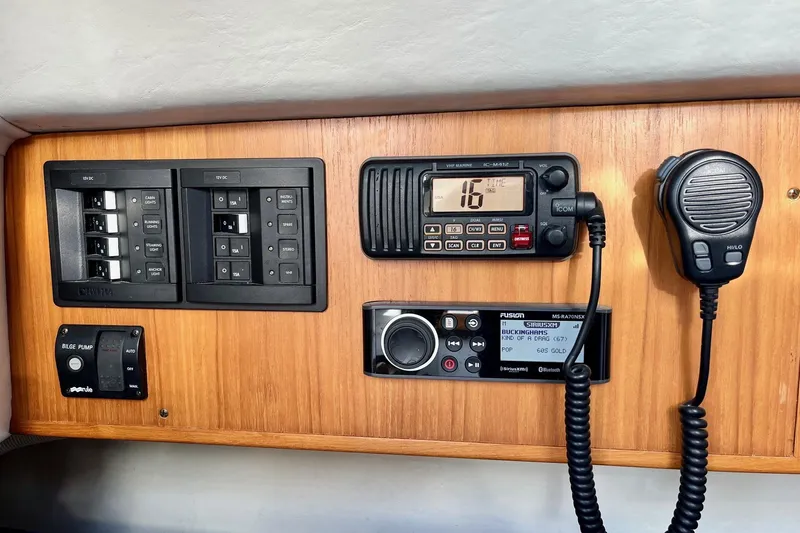 Slide: The Image of Control panel of a 2012 Alerion Express 28 sailboat with radio and switches. - 12