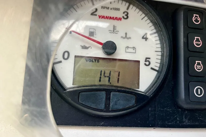 Slide: The Image of Yanmar voltmeter on 2012 Alerion Express 28, displaying 14.1 volts. - 13