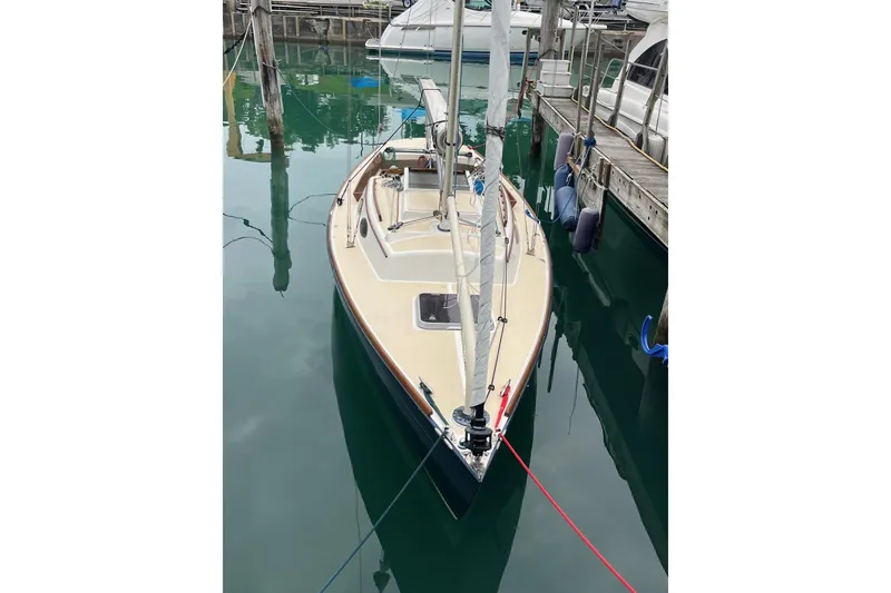 Slide: The Image of Alerion Express 28 sailboat, 2012 model, docked in a marina. - 2