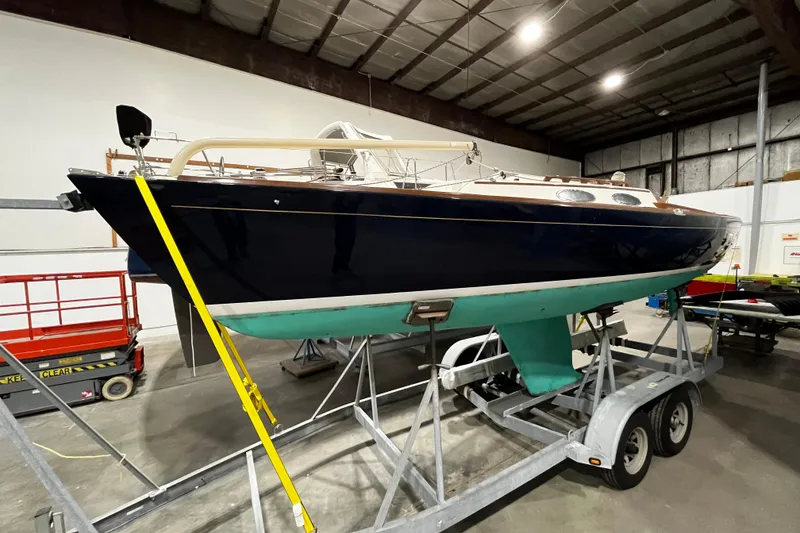 Slide: The Image of 2012 Alerion Express 28 sailboat on trailer in indoor storage facility. - 3
