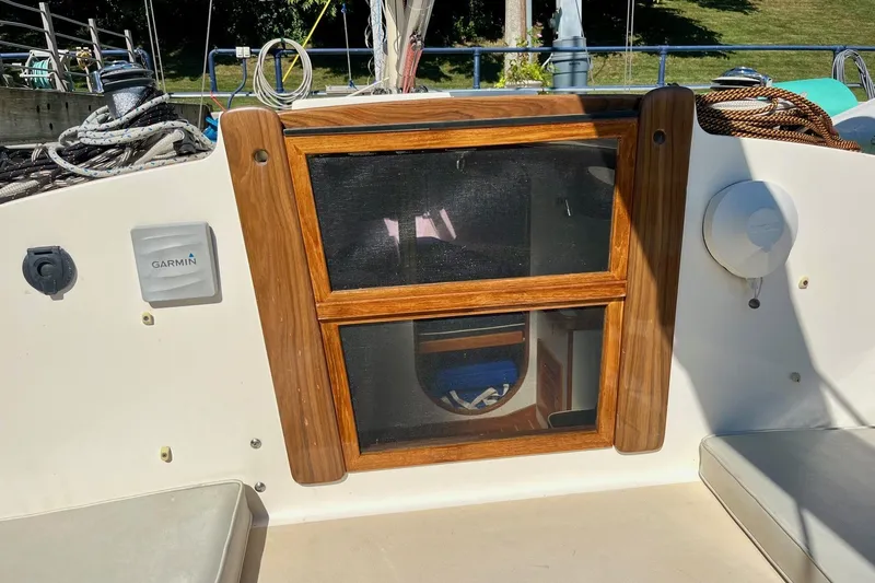 Slide: The Image of Cockpit of 2012 Alerion Express 28 sailboat with Garmin equipment and wooden hatch. - 7