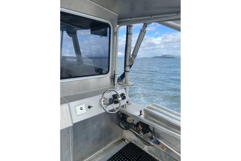Slide: The Image of Interior view of a 2021 Custom Aluminum Crabber boat on the water. - 11