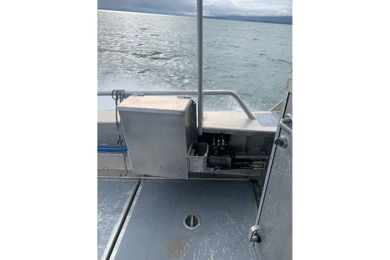 Slide: The Image of Custom 2021 Aluminum Crabber boat on water, featuring metal deck and equipment. - 17