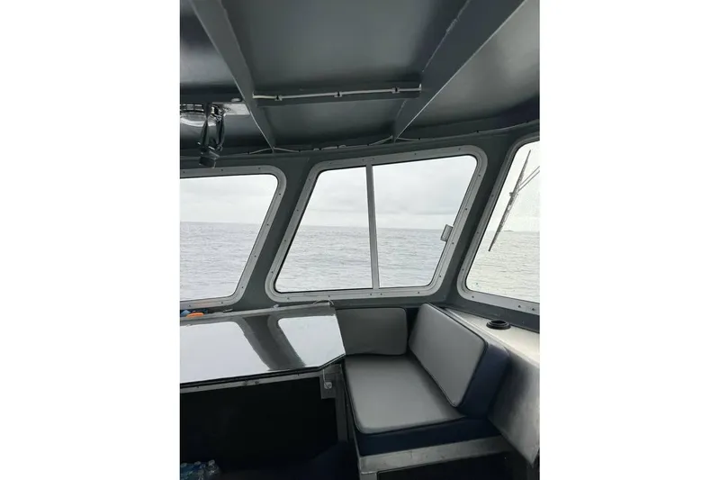 Slide: The Image of Interior view of a 2021 Custom Aluminum Crabber boat with ocean in the background. - 6