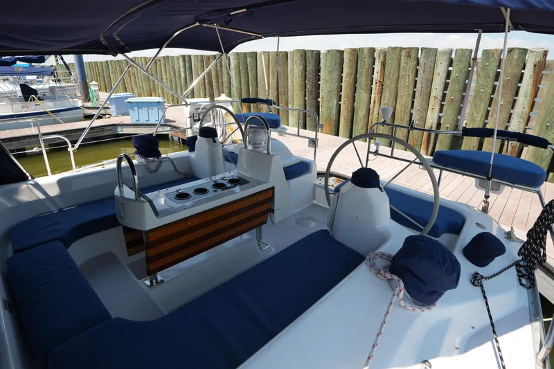 Slide: The Image of Cockpit of 2003 Catalina 400 MkII sailboat with blue seating and wooden accents. - 12