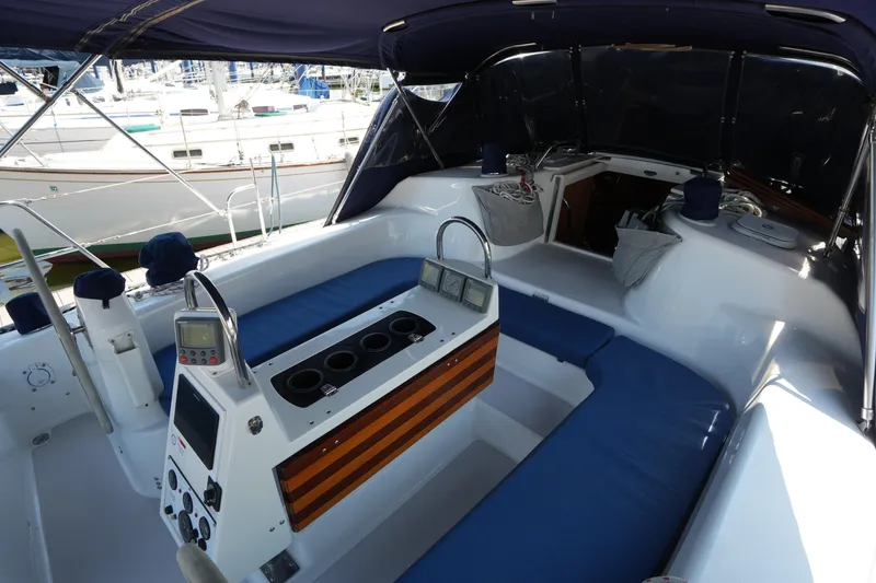 Slide: The Image of Cockpit of 2003 Catalina 400 MkII sailboat with blue seating and navigation instruments. - 15