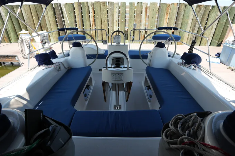 Slide: The Image of Cockpit of 2003 Catalina 400 MkII sailboat with blue seating and dual steering wheels. - 16