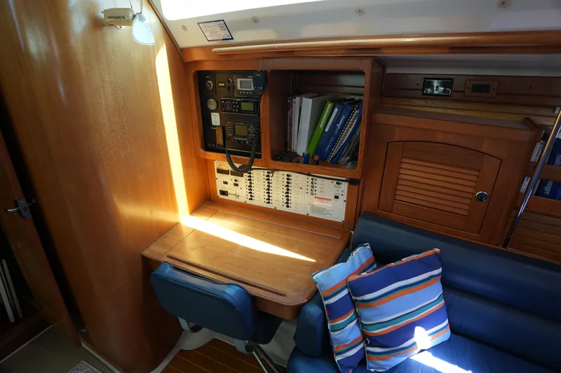 Slide: The Image of Navigation station in a 2003 Catalina 400 MkII sailboat with control panel and seating. - 20