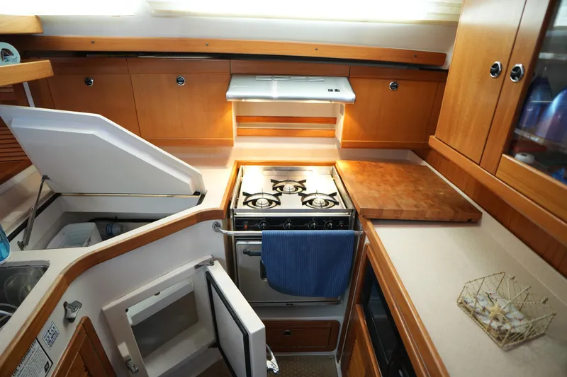 Slide: The Image of Interior of 2003 Catalina 400 MkII with kitchen and stove. - 22