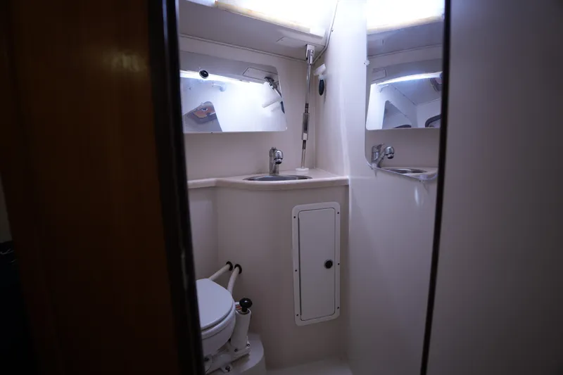 Slide: The Image of Bathroom interior of 2003 Catalina 400 MkII yacht, featuring sink and toilet. - 25