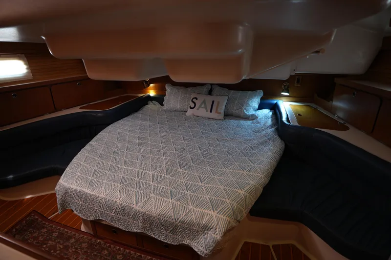 Slide: The Image of Cozy cabin interior of 2003 Catalina 400 MkII sailboat with comfortable bedding. - 28