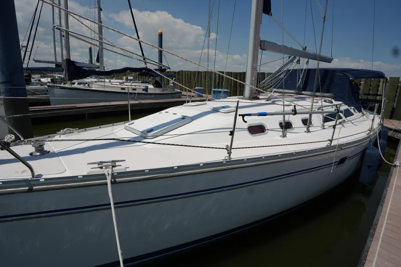 Slide: The Image of 2003 Catalina 400 MkII sailboat docked at marina under clear skies. - 7