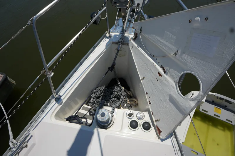 Slide: The Image of Anchor locker of a 2003 Catalina 400 MkII sailboat with chain and winch. - 8