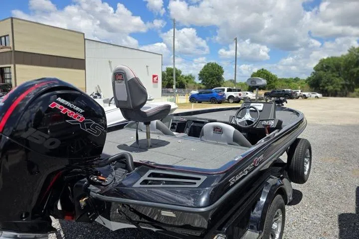 Slide: The Image of 2024 Ranger Z518 Cup-Equipped boat with Mercury Pro XS engine, parked outdoors. - 10