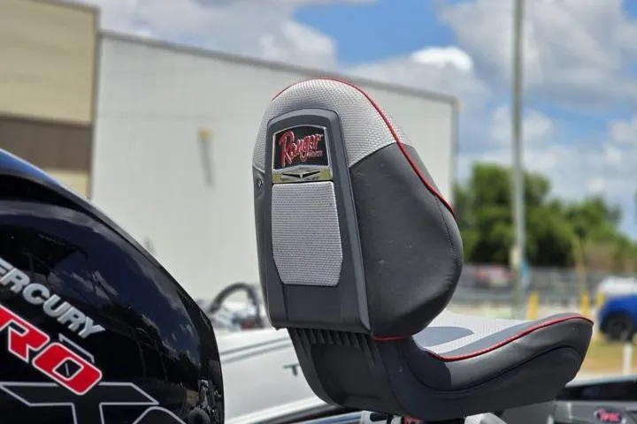 Slide: The Image of 2024 Ranger Z518 Cup-Equipped boat seat with Mercury Pro branding in outdoor setting. - 11