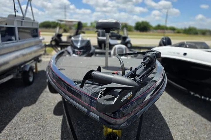 Slide: The Image of 2024 Ranger Z518 Cup-Equipped boat with Minn Kota trolling motor, parked outdoors. - 15