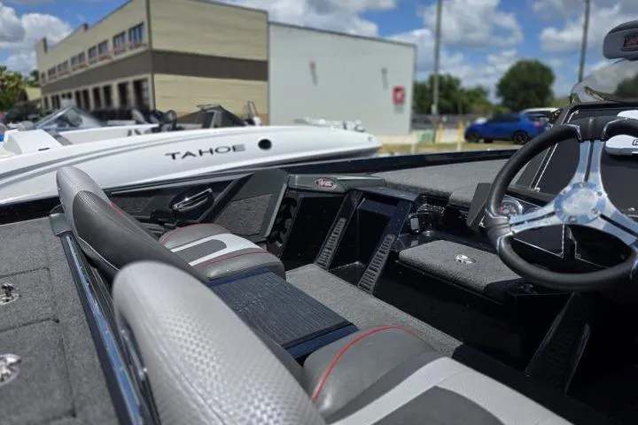 Slide: The Image of 2024 Ranger Z518 Cup-Equipped boat interior with steering wheel and seating. - 19