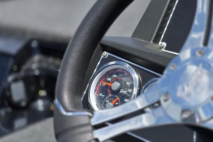 Slide: The Image of Close-up of 2024 Ranger Z518 Cup-Equipped boat dashboard and steering wheel. - 22