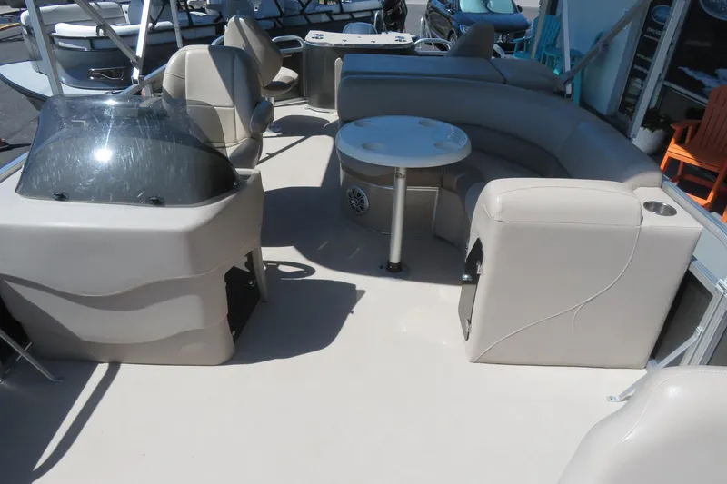 Slide: The Image of 2015 Avalon GS 2185 RF pontoon boat interior with seating and helm. - 11