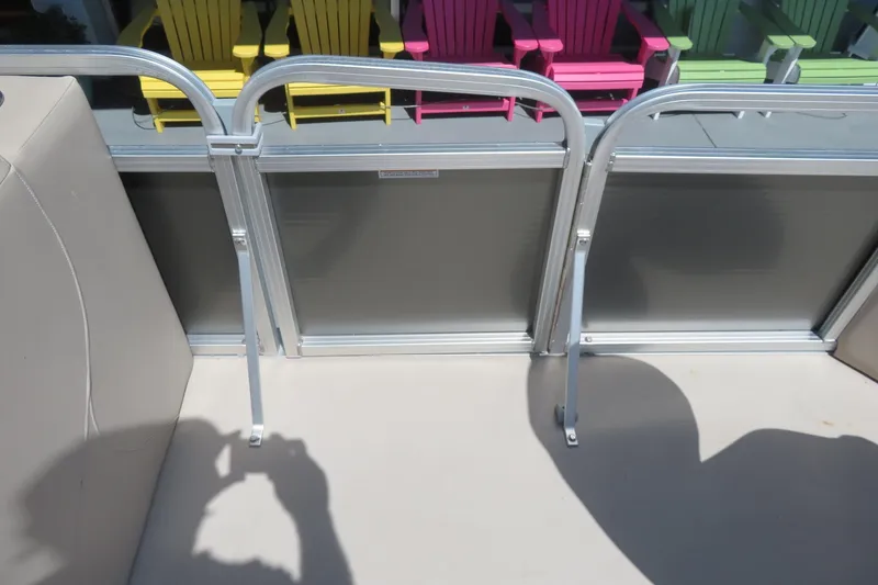 Slide: The Image of 2015 Avalon GS 2185 RF boat interior with colorful chairs in the background. - 13