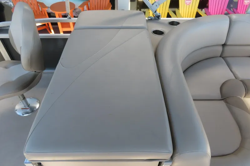 Slide: The Image of 2015 Avalon GS 2185 RF boat interior with gray seating and cup holders. - 16