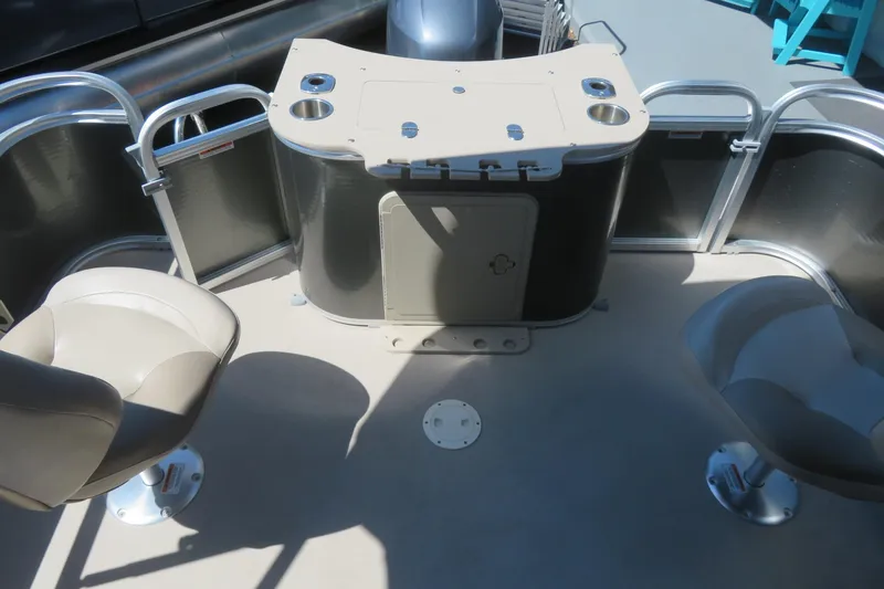 Slide: The Image of 2015 Avalon GS 2185 RF boat interior with seating and storage area. - 19