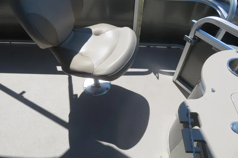 Slide: The Image of Boat interior with a swivel seat on a 2015 Avalon GS 2185 RF. - 20