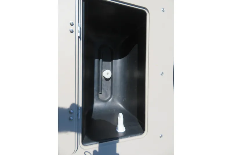 Slide: The Image of Storage compartment of 2015 Avalon GS 2185 RF boat, featuring a black interior. - 23