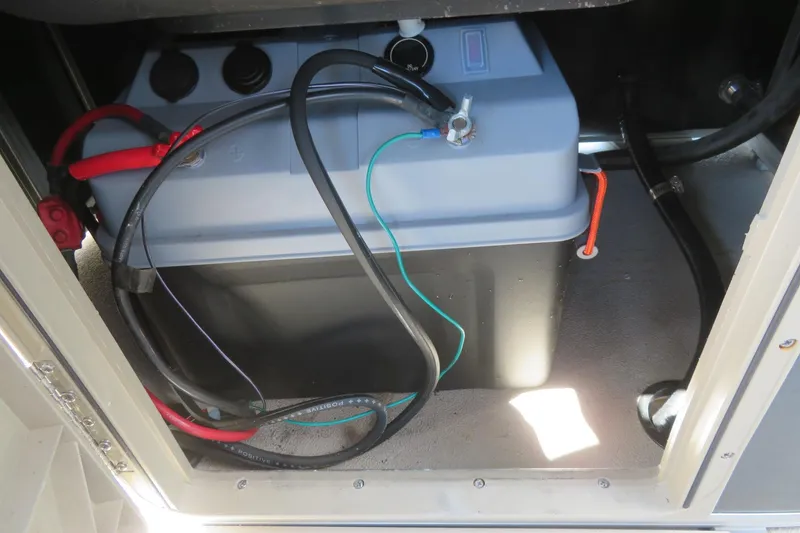 Slide: The Image of Battery compartment of 2015 Avalon GS 2185 RF with connected cables. - 24
