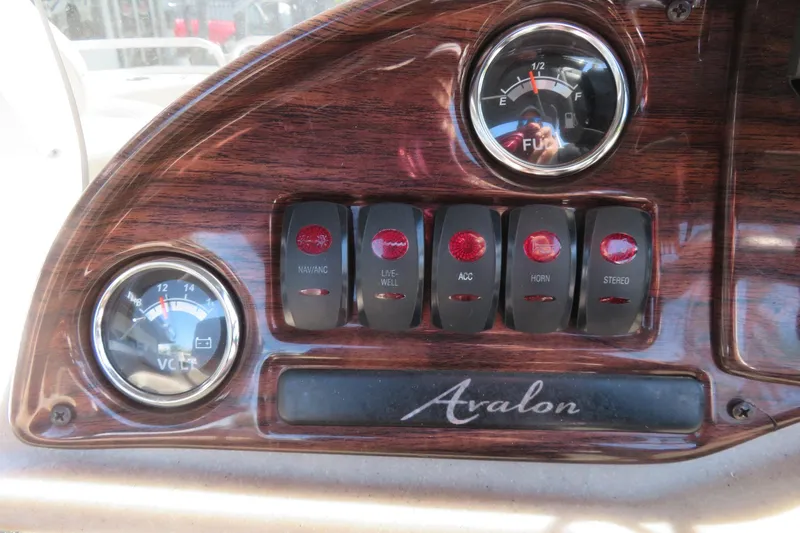 Slide: The Image of Dashboard of 2015 Avalon GS 2185 RF with gauges and control switches. - 29