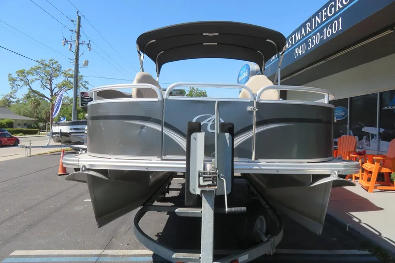Slide: The Image of 2015 Avalon GS 2185 RF pontoon boat on trailer outside dealership. - 3