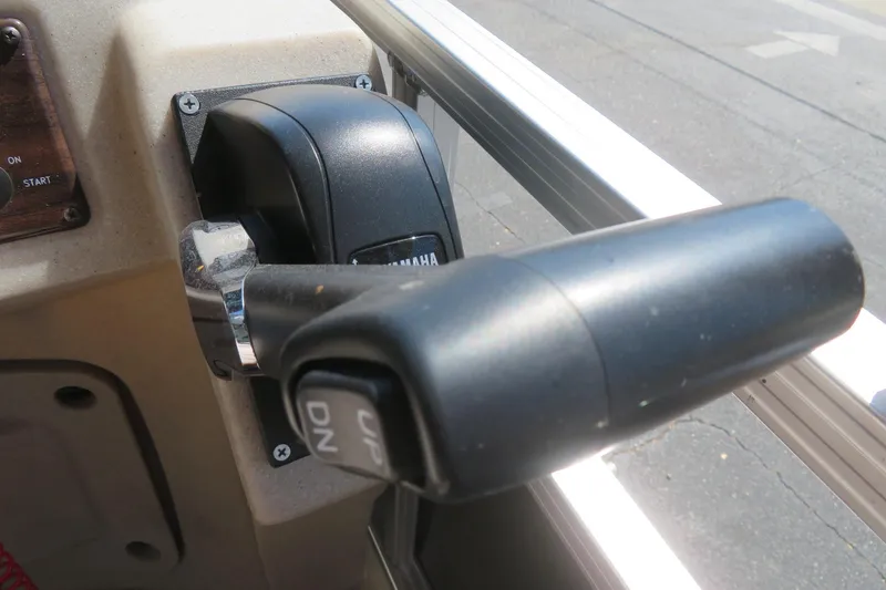 Slide: The Image of Close-up of a Yamaha throttle control on a 2015 Avalon GS 2185 RF boat. - 32