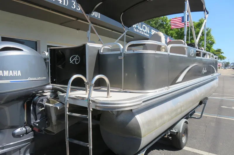 Slide: The Image of 2015 Avalon GS 2185 RF pontoon boat with Yamaha engine in parking lot. - 6
