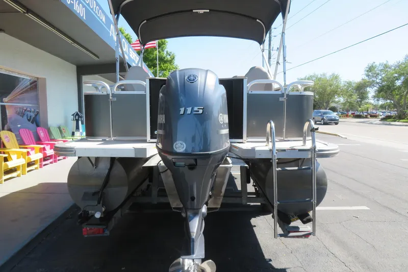 Slide: The Image of 2015 Avalon GS 2185 RF pontoon boat with Yamaha 115 engine, parked outdoors. - 7