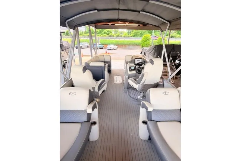 Slide: The Image of 2019 Veranda VP25RC pontoon boat interior with plush seating and modern helm. - 10