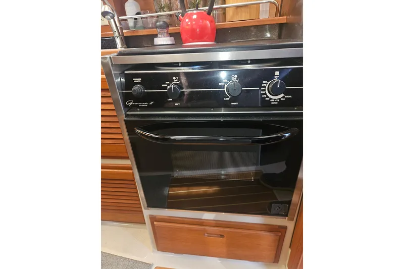 Slide: The Image of Galley kitchen oven in 2014 Ranger Tugs R-27 boat interior. - 15