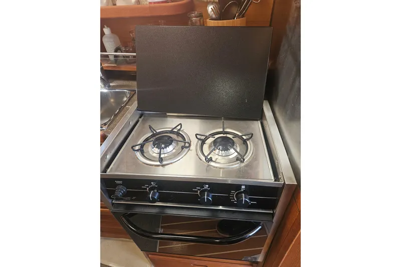 Slide: The Image of Two-burner stove in 2014 Ranger Tugs R-27 boat kitchen. - 16