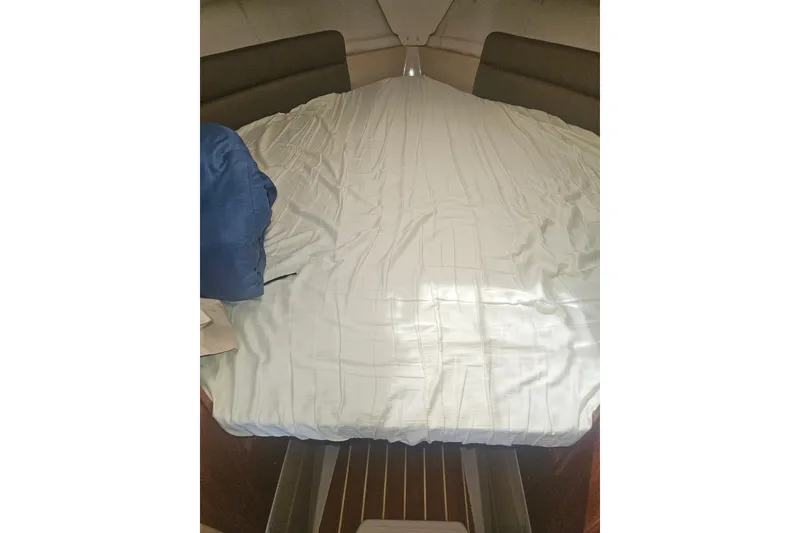 Slide: The Image of Cozy cabin interior of 2014 Ranger Tugs R-27 with neatly made bed. - 19