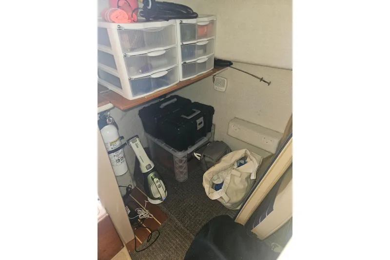 Slide: The Image of Storage area in a 2014 Ranger Tugs R-27 boat with organized supplies and equipment. - 22