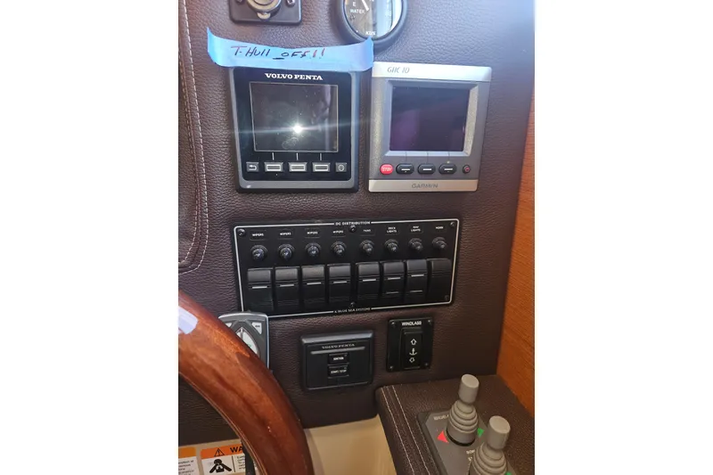 Slide: The Image of Control panel of a 2014 Ranger Tugs R-27 boat with Volvo Penta and Garmin displays. - 25