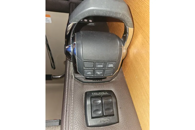 Slide: The Image of Close-up of 2014 Ranger Tugs R-27 boat throttle controls and switches. - 28