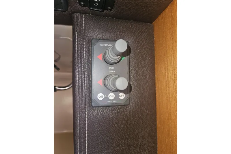 Slide: The Image of Control panel for bow and stern thrusters on a 2014 Ranger Tugs R-27 boat. - 29