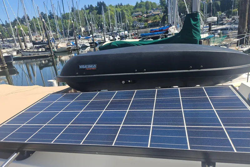 Slide: The Image of Solar panel on 2014 Ranger Tugs R-27 boat at marina with Yakima storage box. - 35
