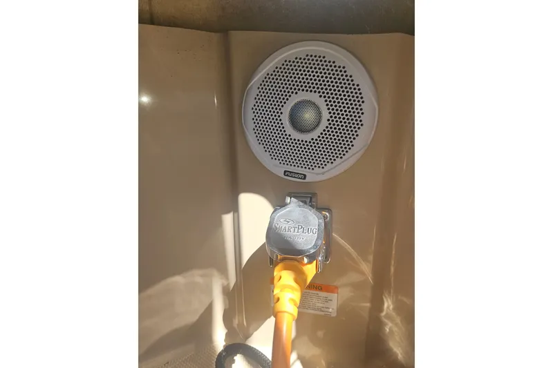 Slide: The Image of Speaker and SmartPlug on 2014 Ranger Tugs R-27 boat interior. - 37