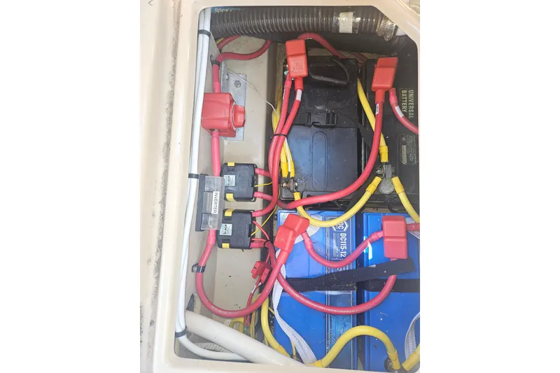 Slide: The Image of Electrical system of a 2014 Ranger Tugs R-27 boat, featuring batteries and wiring. - 40