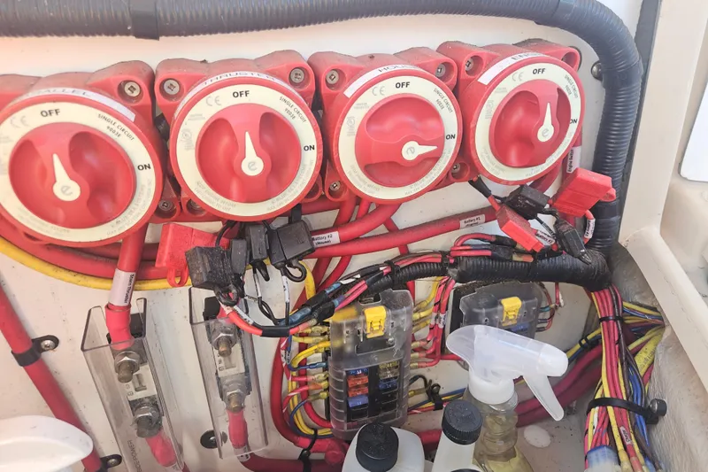Slide: The Image of Electrical panel with switches and wiring on a 2014 Ranger Tugs R-27 boat. - 44