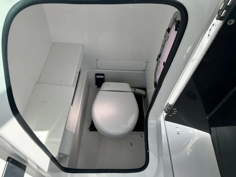 Slide: The Image of Interior of 2024 Blackfin 252 DC featuring a toilet. - 20